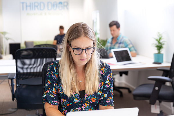 The London co-working space with a nursery -A woman working at Third Door