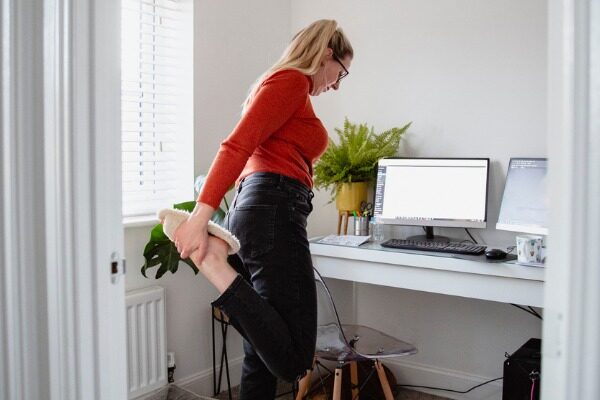 Freelancer stretching at home