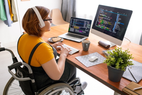 Woman in a wheelchair working at a desk